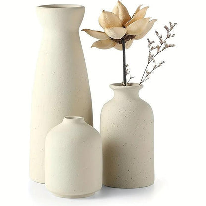 Elara Haus Speckled Ceramic Vase Set Trio, featuring a mix of flowers in the 3 ceramic vases